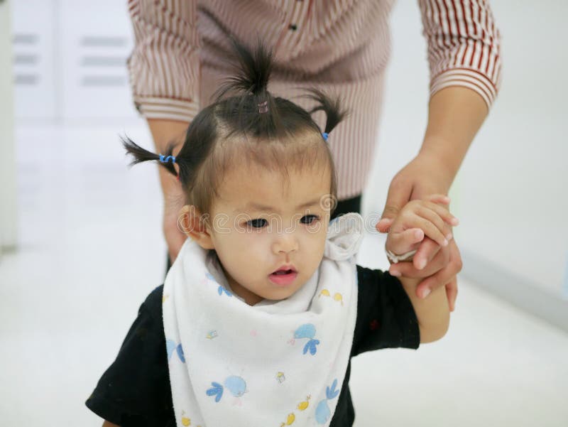 Asian Baby Girl Learning To Walk with Help from Her Mother Stock Image - Image of light, learning: 113671495 Asian Baby Girl Learning To Walk with Help from Her Mother Stock Image - Image of light, learning: 113671495