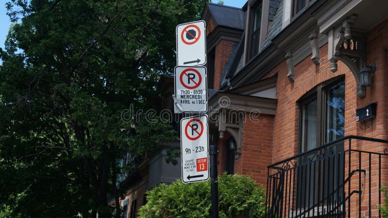 Montreal, QC/ Canada - 6/24/2020: Parking challenge in downtown. No Parking signs: middle Wednesdays from 7:30 to 8:30 AM, from Apr 1st to Dec 1st, bottom 9:00 AM to 11:00 PM except for sector 13. Montreal, QC/ Canada - 6/24/2020: Parking challenge in downtown. No Parking signs: middle Wednesdays from 7:30 to 8:30 AM, from Apr 1st to Dec 1st, bottom 9:00 AM to 11:00 PM except for sector 13.