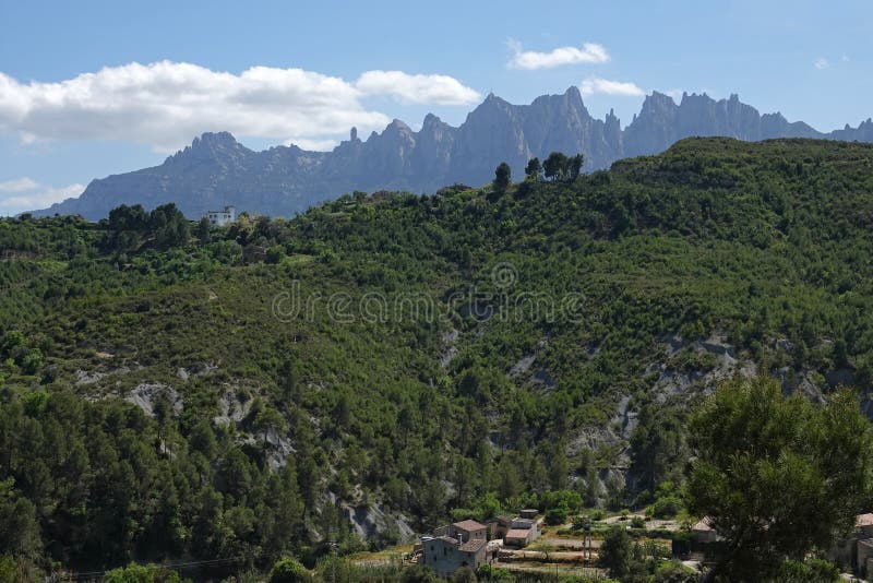 Montserrat saw mountain range from Manresa near Barcelona in Spain. Montserrat means saw mountain in Catalan. The mountain is composed of strikingly pink stock photography Montserrat saw mountain range from Manresa near Barcelona in Spain. Montserrat means saw mountain in Catalan. The mountain is composed of strikingly pink stock photography