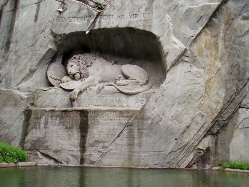 The sculptural composition `The Dying Lion`. Lucerne. Switzerland. 05/03/2019. Dedicated to the valor of the fallen Swiss guards at the Tuileries Palace. The lion`s left shoulder is pierced by a spear. The sculptural composition `The Dying Lion`. Lucerne. Switzerland. 05/03/2019. Dedicated to the valor of the fallen Swiss guards at the Tuileries Palace. The lion`s left shoulder is pierced by a spear