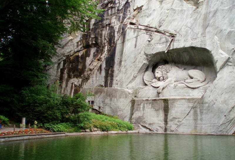 The sculptural composition `The Dying Lion`. Lucerne. Switzerland. 05/03/2019. Dedicated to the valor of the fallen Swiss guards at the Tuileries Palace. The lion`s left shoulder is pierced by a spear. The sculptural composition `The Dying Lion`. Lucerne. Switzerland. 05/03/2019. Dedicated to the valor of the fallen Swiss guards at the Tuileries Palace. The lion`s left shoulder is pierced by a spear