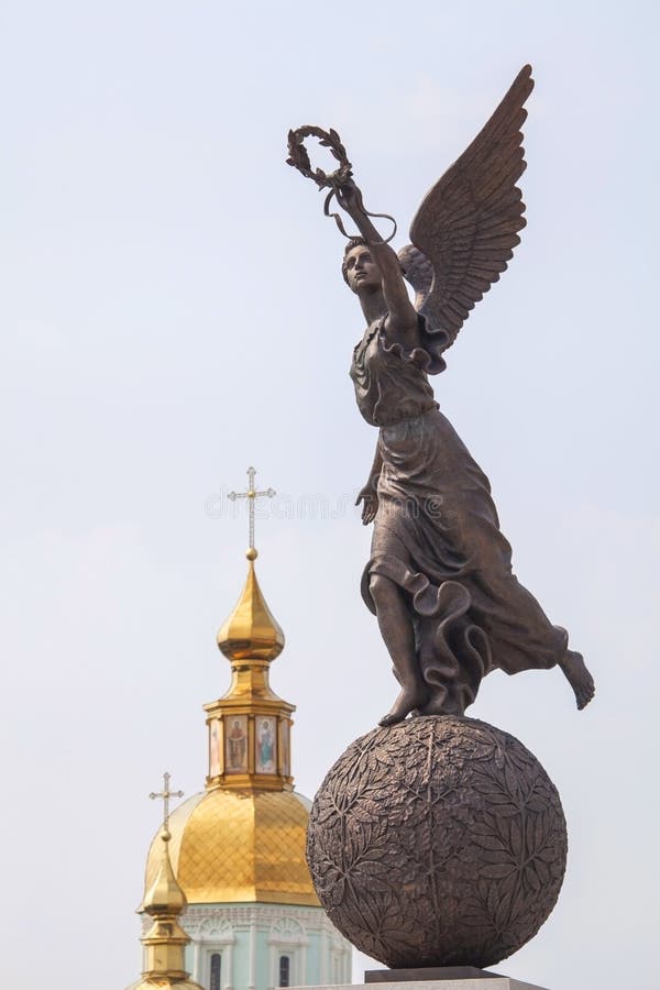 Monument To Goddess Nike on Sphere Against Cupolas of the Church. Stock Photo - of religion, gold: 40847512