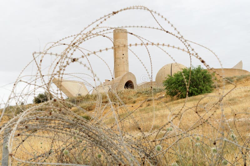 Monument to the Negev Brigade in Beer Sheva, Israel, seen through the barbed wire