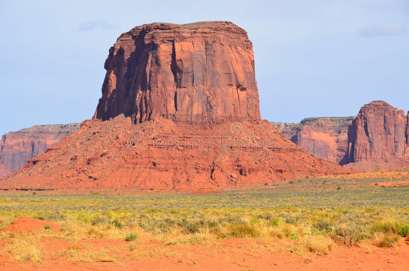 Monument Valley is a region of the Colorado Plateau characterized by a cluster of vast sandstone buttes above the valley floor. It is located on the Arizona-Utah state line, USA