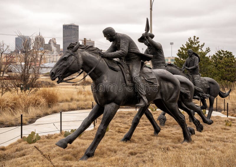 Pictured is the `Centennial Land Run Monument` by artist Paul Moore in Oklahoma City, Oklahoma. The monument commemorates the opening of the Unassigned Land in Oklahoma Territory with the Land Run of 1889. It is one of the worldâ€™s largest bronze sculptures featuring 45 heroic figures of land run participants as they race to claim new homesteads.  The monument is a city park and is open to the public year around 2r hours a day with free admission.  The sculptures were created from bronze and stainless steel between April 2003 and 2015. Pictured is the `Centennial Land Run Monument` by artist Paul Moore in Oklahoma City, Oklahoma. The monument commemorates the opening of the Unassigned Land in Oklahoma Territory with the Land Run of 1889. It is one of the worldâ€™s largest bronze sculptures featuring 45 heroic figures of land run participants as they race to claim new homesteads.  The monument is a city park and is open to the public year around 2r hours a day with free admission.  The sculptures were created from bronze and stainless steel between April 2003 and 2015.