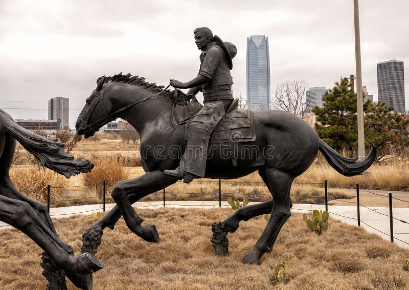 Pictured is the `Centennial Land Run Monument` by artist Paul Moore in Oklahoma City, Oklahoma. The monument commemorates the opening of the Unassigned Land in Oklahoma Territory with the Land Run of 1889. It is one of the worldâ€™s largest bronze sculptures featuring 45 heroic figures of land run participants as they race to claim new homesteads.  The monument is a city park and is open to the public year around 2r hours a day with free admission.  The sculptures were created from bronze and stainless steel between April 2003 and 2015. Pictured is the `Centennial Land Run Monument` by artist Paul Moore in Oklahoma City, Oklahoma. The monument commemorates the opening of the Unassigned Land in Oklahoma Territory with the Land Run of 1889. It is one of the worldâ€™s largest bronze sculptures featuring 45 heroic figures of land run participants as they race to claim new homesteads.  The monument is a city park and is open to the public year around 2r hours a day with free admission.  The sculptures were created from bronze and stainless steel between April 2003 and 2015.