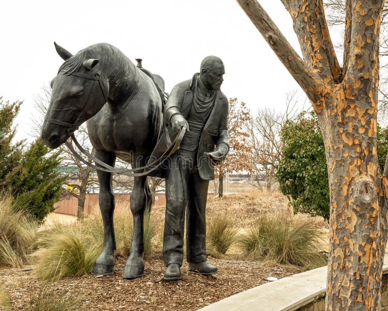 Pictured is the `Centennial Land Run Monument` by artist Paul Moore in Oklahoma City, Oklahoma. The monument commemorates the opening of the Unassigned Land in Oklahoma Territory with the Land Run of 1889. It is one of the worldâ€™s largest bronze sculptures featuring 45 heroic figures of land run participants as they race to claim new homesteads.  The monument is a city park and is open to the public year around 2r hours a day with free admission.  The sculptures were created from bronze and stainless steel between April 2003 and 2015. Pictured is the `Centennial Land Run Monument` by artist Paul Moore in Oklahoma City, Oklahoma. The monument commemorates the opening of the Unassigned Land in Oklahoma Territory with the Land Run of 1889. It is one of the worldâ€™s largest bronze sculptures featuring 45 heroic figures of land run participants as they race to claim new homesteads.  The monument is a city park and is open to the public year around 2r hours a day with free admission.  The sculptures were created from bronze and stainless steel between April 2003 and 2015.