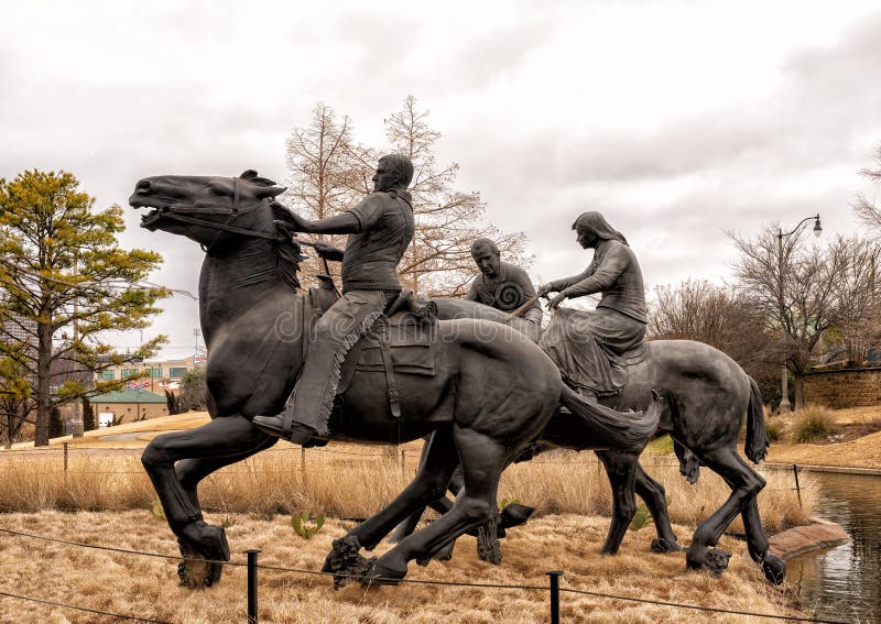 Pictured is the `Centennial Land Run Monument` by artist Paul Moore in Oklahoma City, Oklahoma. The monument commemorates the opening of the Unassigned Land in Oklahoma Territory with the Land Run of 1889. It is one of the worldâ€™s largest bronze sculptures featuring 45 heroic figures of land run participants as they race to claim new homesteads.  The monument is a city park and is open to the public year around 2r hours a day with free admission.  The sculptures were created from bronze and stainless steel between April 2003 and 2015. Pictured is the `Centennial Land Run Monument` by artist Paul Moore in Oklahoma City, Oklahoma. The monument commemorates the opening of the Unassigned Land in Oklahoma Territory with the Land Run of 1889. It is one of the worldâ€™s largest bronze sculptures featuring 45 heroic figures of land run participants as they race to claim new homesteads.  The monument is a city park and is open to the public year around 2r hours a day with free admission.  The sculptures were created from bronze and stainless steel between April 2003 and 2015.
