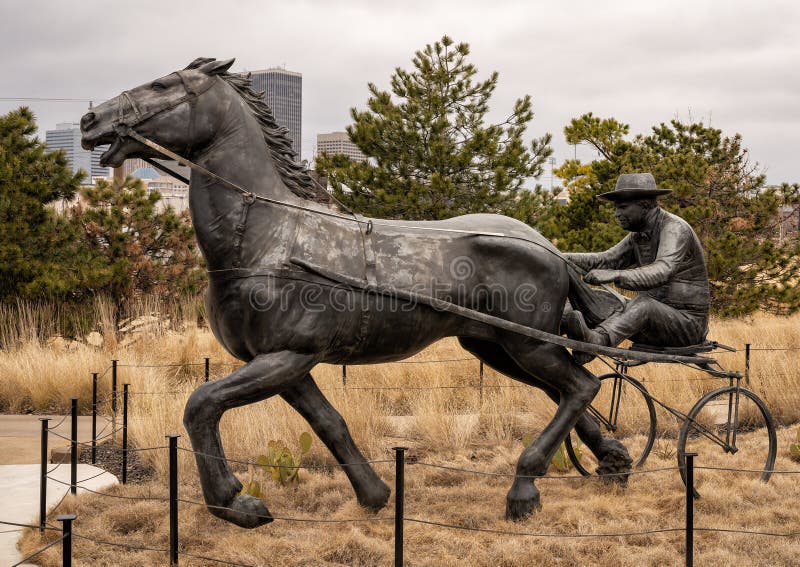 Pictured is the `Centennial Land Run Monument` by artist Paul Moore in Oklahoma City, Oklahoma. The monument commemorates the opening of the Unassigned Land in Oklahoma Territory with the Land Run of 1889. It is one of the worldâ€™s largest bronze sculptures featuring 45 heroic figures of land run participants as they race to claim new homesteads.  The monument is a city park and is open to the public year around 2r hours a day with free admission.  The sculptures were created from bronze and stainless steel between April 2003 and 2015. Pictured is the `Centennial Land Run Monument` by artist Paul Moore in Oklahoma City, Oklahoma. The monument commemorates the opening of the Unassigned Land in Oklahoma Territory with the Land Run of 1889. It is one of the worldâ€™s largest bronze sculptures featuring 45 heroic figures of land run participants as they race to claim new homesteads.  The monument is a city park and is open to the public year around 2r hours a day with free admission.  The sculptures were created from bronze and stainless steel between April 2003 and 2015.