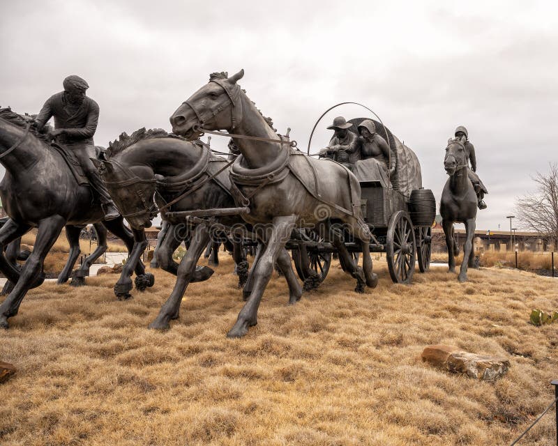 Pictured is the `Centennial Land Run Monument` by artist Paul Moore in Oklahoma City, Oklahoma. The monument commemorates the opening of the Unassigned Land in Oklahoma Territory with the Land Run of 1889. It is one of the worldâ€™s largest bronze sculptures featuring 45 heroic figures of land run participants as they race to claim new homesteads.  The monument is a city park and is open to the public year around 2r hours a day with free admission.  The sculptures were created from bronze and stainless steel between April 2003 and 2015. Pictured is the `Centennial Land Run Monument` by artist Paul Moore in Oklahoma City, Oklahoma. The monument commemorates the opening of the Unassigned Land in Oklahoma Territory with the Land Run of 1889. It is one of the worldâ€™s largest bronze sculptures featuring 45 heroic figures of land run participants as they race to claim new homesteads.  The monument is a city park and is open to the public year around 2r hours a day with free admission.  The sculptures were created from bronze and stainless steel between April 2003 and 2015.