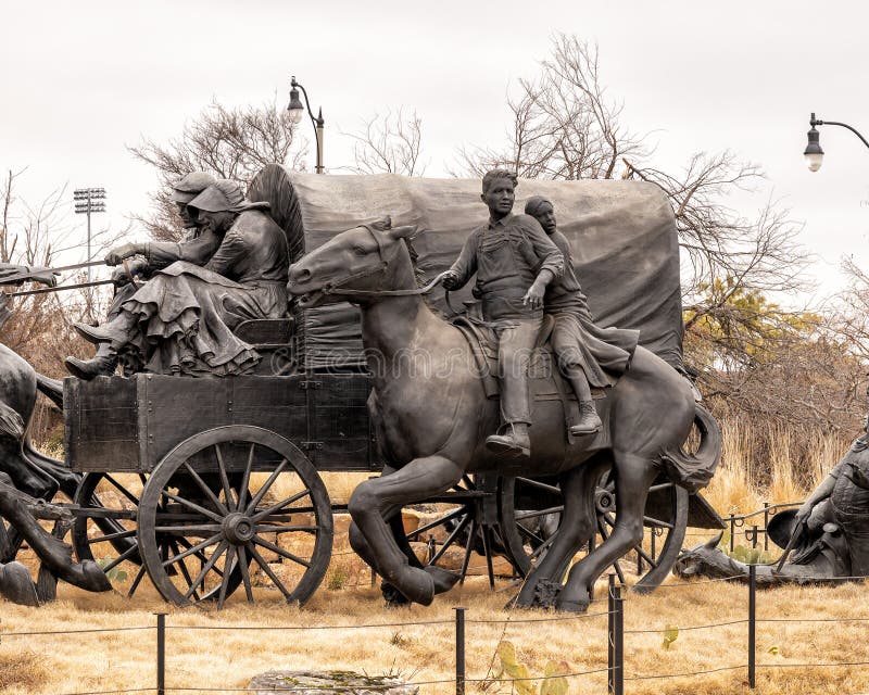 Pictured is the `Centennial Land Run Monument` by artist Paul Moore in Oklahoma City, Oklahoma. The monument commemorates the opening of the Unassigned Land in Oklahoma Territory with the Land Run of 1889. It is one of the worldâ€™s largest bronze sculptures featuring 45 heroic figures of land run participants as they race to claim new homesteads.  The monument is a city park and is open to the public year around 2r hours a day with free admission.  The sculptures were created from bronze and stainless steel between April 2003 and 2015. Pictured is the `Centennial Land Run Monument` by artist Paul Moore in Oklahoma City, Oklahoma. The monument commemorates the opening of the Unassigned Land in Oklahoma Territory with the Land Run of 1889. It is one of the worldâ€™s largest bronze sculptures featuring 45 heroic figures of land run participants as they race to claim new homesteads.  The monument is a city park and is open to the public year around 2r hours a day with free admission.  The sculptures were created from bronze and stainless steel between April 2003 and 2015.