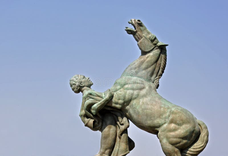 Monument,horse and man isolated on the blue sky background. Monument,horse and man isolated on the blue sky background