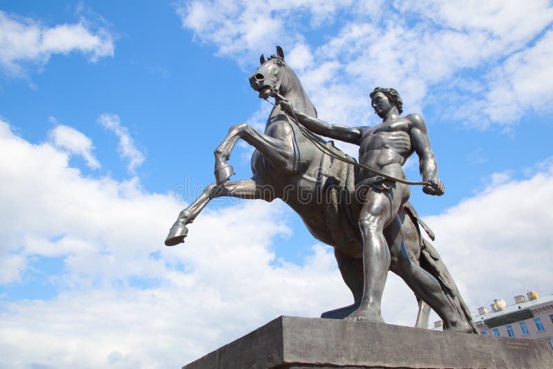 The Horse Tamers monument by Peter Klodt 1851 on Anichkov Bridge in Saint Petersburg, Russia. Landmark. The Horse Tamers monument by Peter Klodt 1851 on Anichkov Bridge in Saint Petersburg, Russia. Landmark