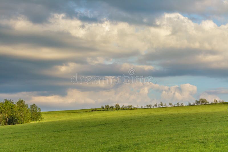 Moody cloudy sky over green hills royalty free stock images Moody cloudy sky over green hills royalty free stock images