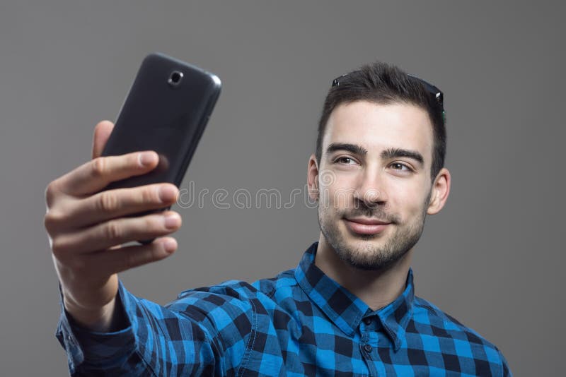 Moody Portrait Of Young Confident Happy Man Taking Self Portrait With ...