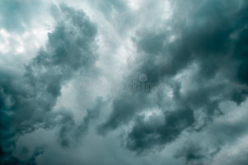 Ominous dark thunderstorm clouds in the sky(green-cyan toned version). Ominous dark thunderstorm clouds in the sky(green-cyan toned version)