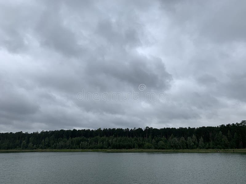 Moody weather at the lake stock photo. Image of reflection 199932432