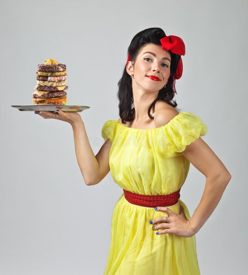 Mooi brunette met grote Hamburger royalty-vrije stock fotografie Mooi brunette met grote Hamburger royalty-vrije stock fotografie