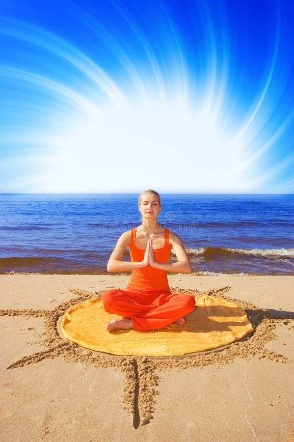 Beautiful meditating girl on the beach. Beautiful meditating girl on the beach
