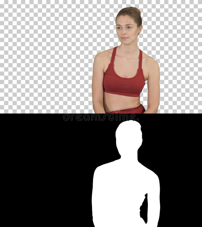 Mooi meisje die in sportkleding aan iemand luisteren die aan haar, Alpha Channel spreken stock afbeelding Mooi meisje die in sportkleding aan iemand luisteren die aan haar, Alpha Channel spreken stock afbeelding