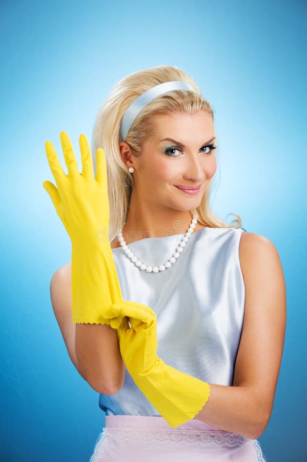 Beautiful happy housewife with rubber gloves. Beautiful happy housewife with rubber gloves