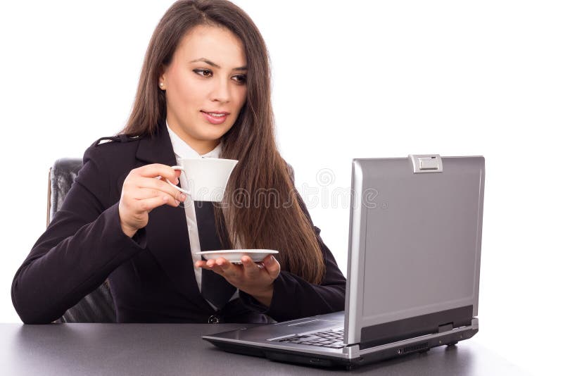 Mooie jonge onderneemster het drinken koffie/thee stock afbeelding Mooie jonge onderneemster het drinken koffie/thee stock afbeelding