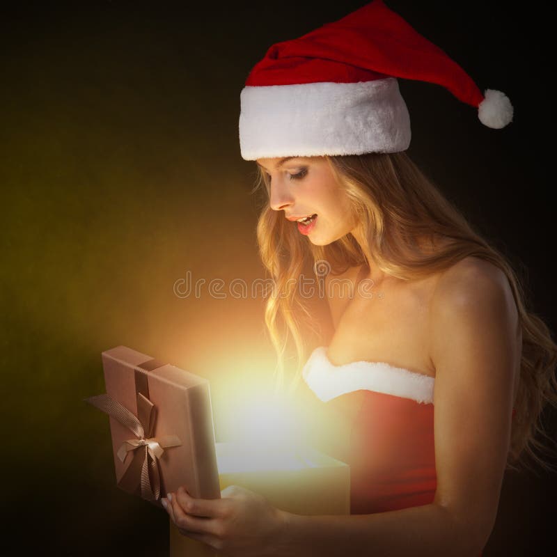 Beautiful christmas woman open gold gift. Beautiful christmas woman open gold gift