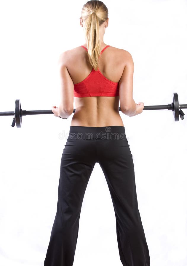 Mooi meisje tilt gewichten royalty-vrije stock afbeelding