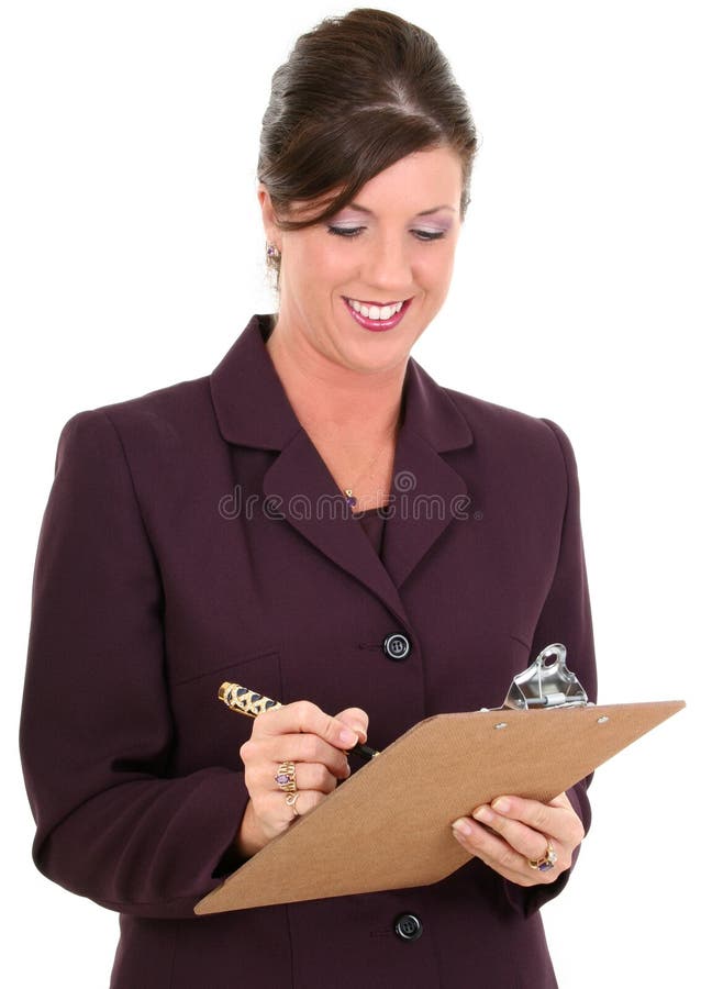 Beautiful Businesswoman Taking Notes. Holding pen and clipboard. Smiling. Shot in studio. Beautiful Businesswoman Taking Notes. Holding pen and clipboard. Smiling. Shot in studio.