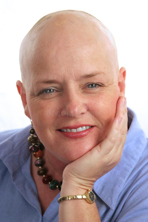 A portrait of a beautiful breast cancer survivor with a positive attitude. A portrait of a beautiful breast cancer survivor with a positive attitude.