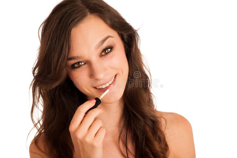 Mooie Spaanse vrouwen aplying lipgloss stock foto Mooie Spaanse vrouwen aplying lipgloss stock foto