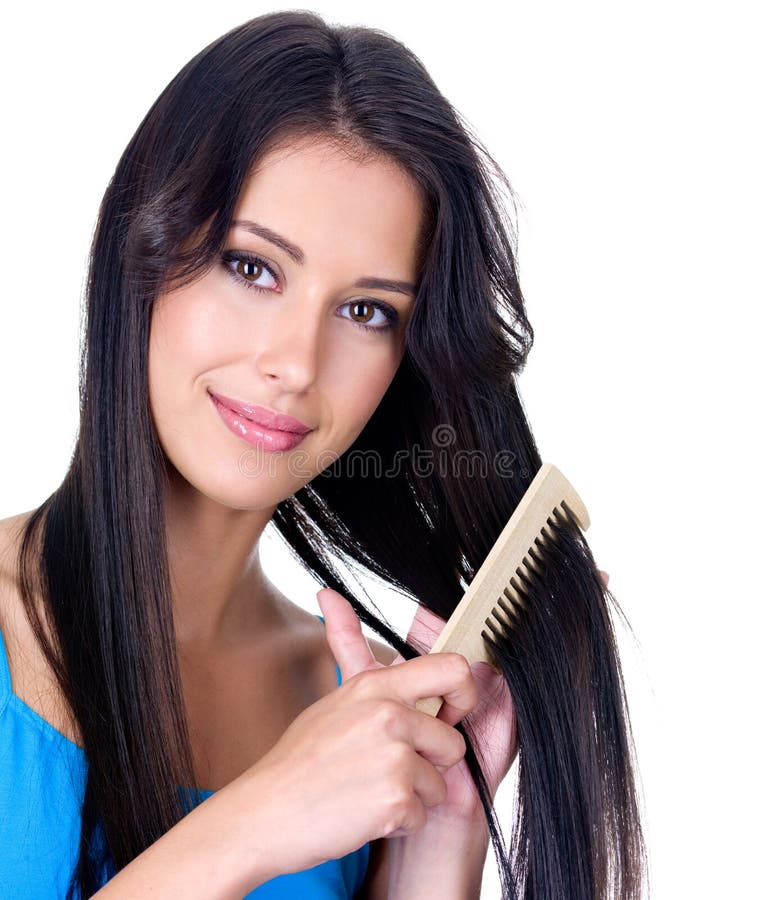 Close-up portrait of beautiful pretty woman with comb caring about her long hair - isolated. Close-up portrait of beautiful pretty woman with comb caring about her long hair - isolated