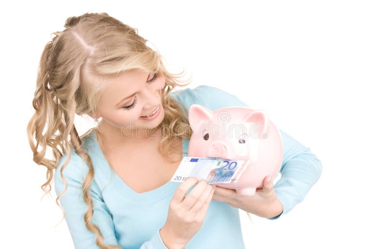 Lieve vrouw met spaarvarken en geld stock fotografie