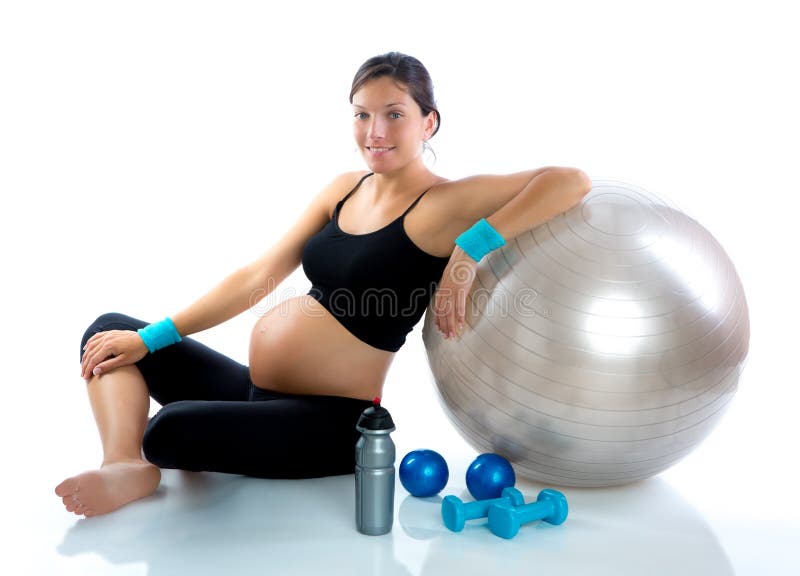 Mooie zwangere vrouw bij ontspannen geschiktheidsgymnastiek stock foto Mooie zwangere vrouw bij ontspannen geschiktheidsgymnastiek stock foto