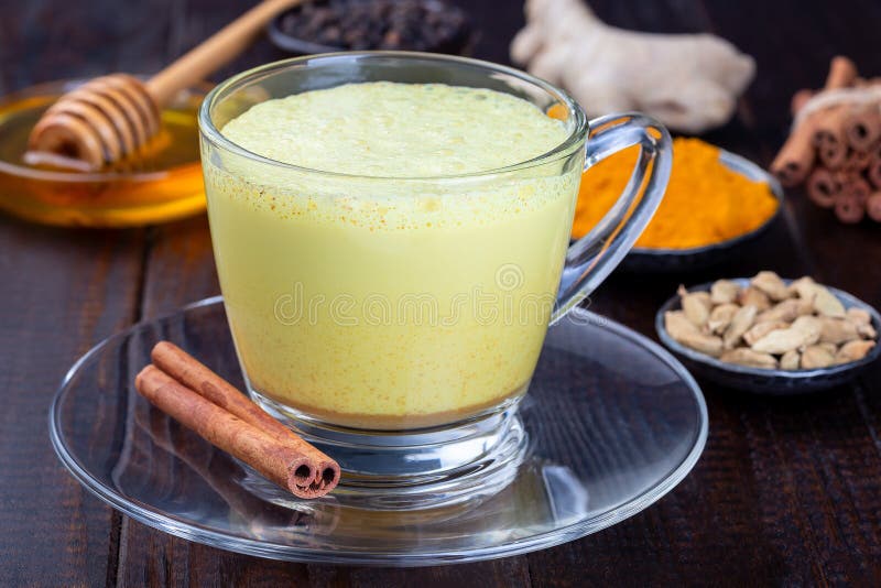 Moon Milk with Turmeric in Glass Cup, Ingredients on Background ...