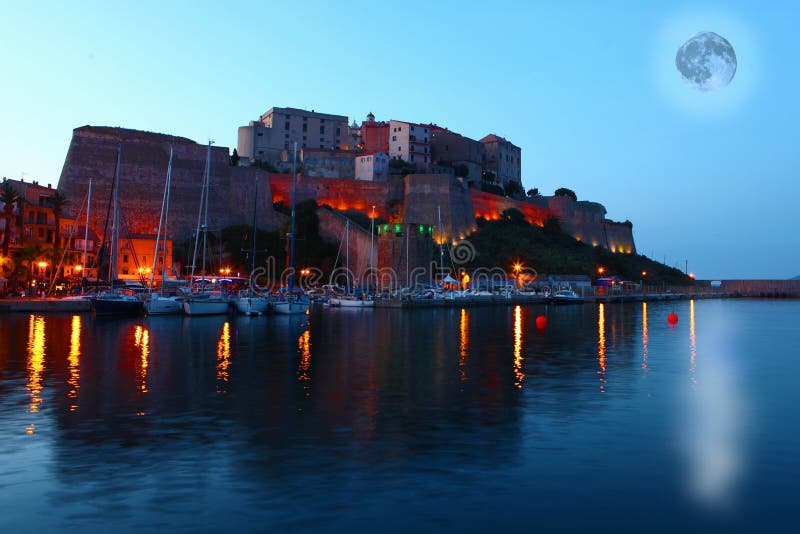 Moon rising over Calvi, France royalty free stock photos Moon rising over Calvi, France royalty free stock photos