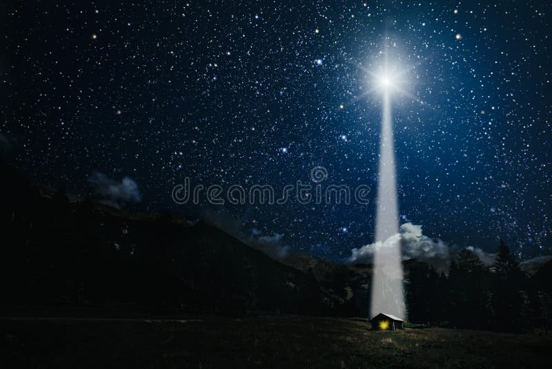 moon shines over the manger of christmas of Jesus Christ.
