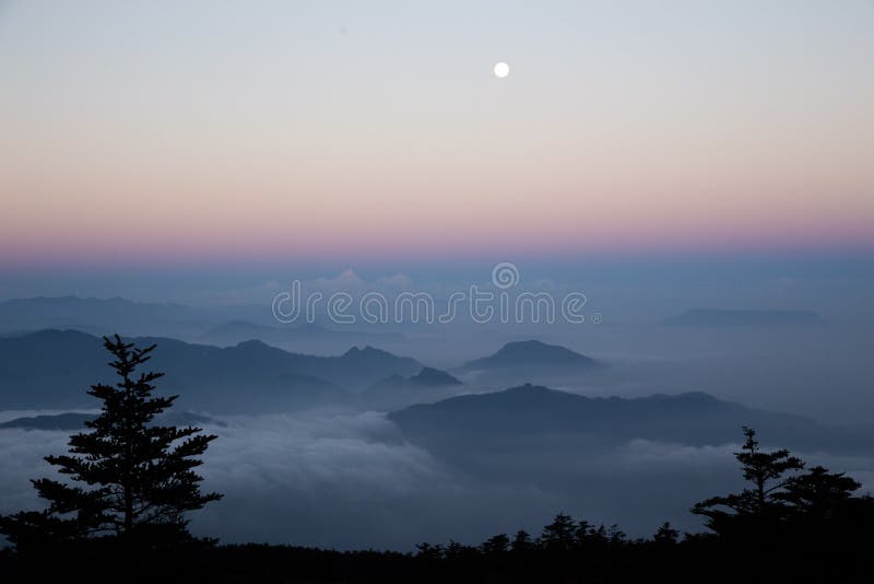 Moon watches Sea of clouds at Sunrise