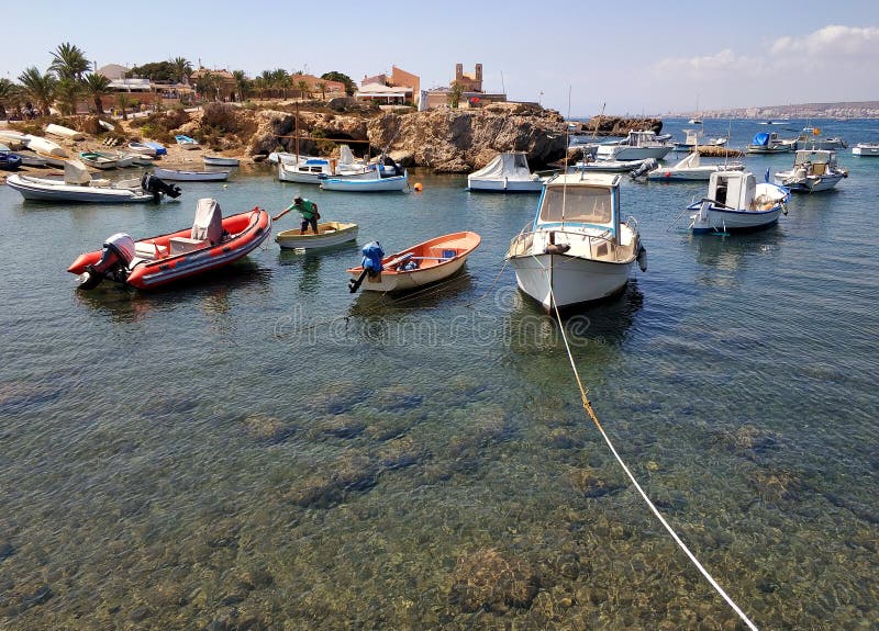 Moored fishing boatin the bay of Mediterranean Sea in Tabarca Island. Tabarca Island, Spain - September 4, 2018: Moored docked fishing motor boats in bay of royalty free stock photography Moored fishing boatin the bay of Mediterranean Sea in Tabarca Island. Tabarca Island, Spain - September 4, 2018: Moored docked fishing motor boats in bay of royalty free stock photography