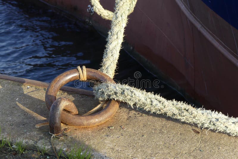 Mooring ring and rope on the quay.