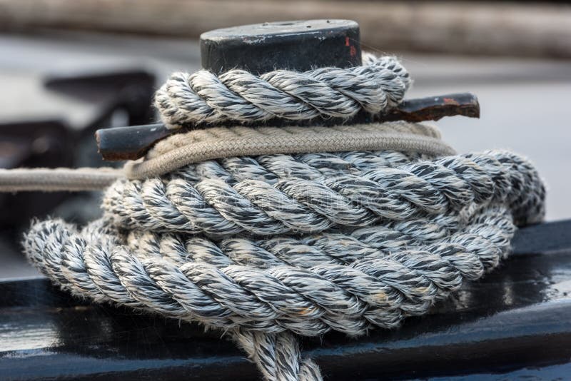 Mooring rope tied around a cleat stock image Mooring rope tied around a cleat stock image