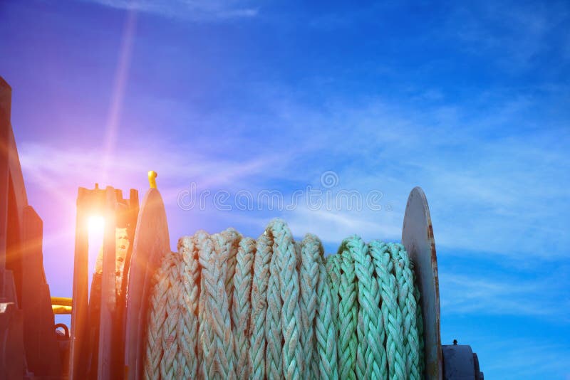 Mooring winch front of Vessel closeup rope on blue sky