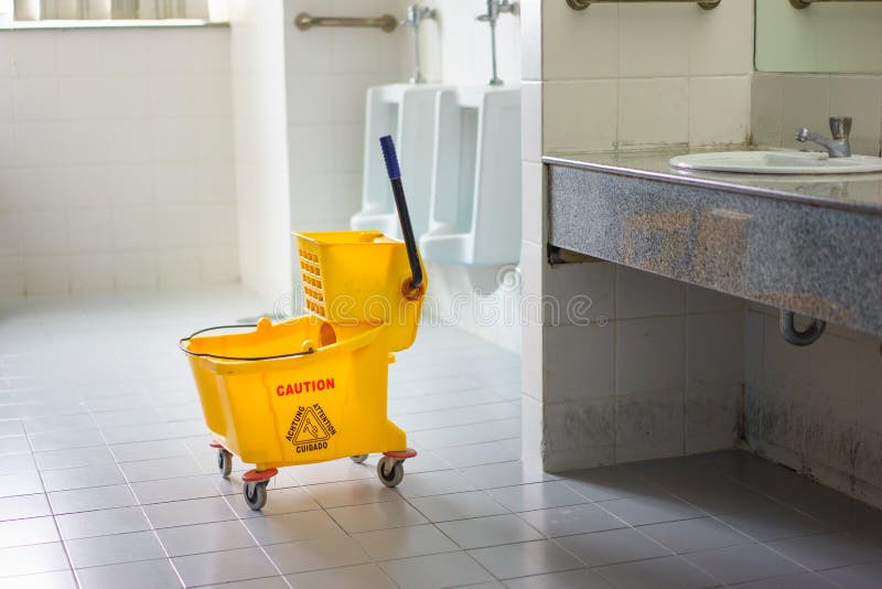 Mop Bucket on Wet Floor in Toilet Stock Image Image of information