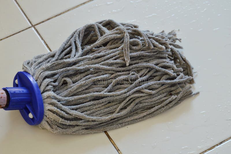 Mop the tile floor in home stock image. Image of diligent 67531615