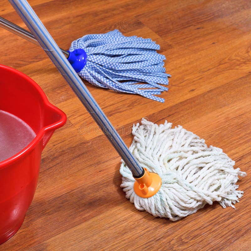 Mopping Of Wood Floors By Two Mops Stock Photo - Image ...