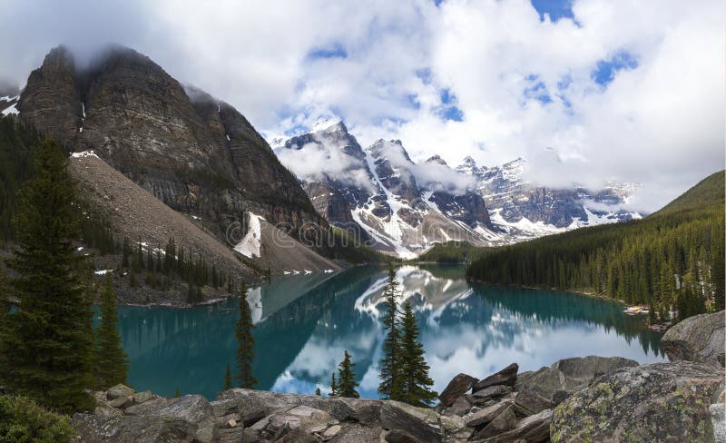 Moraine Lake, a glacially-fed lake in Banff National Park, Alberta, Canada, situated in the Valley of the Ten Peaks. Surrounded by the snow covered peaks of the Rocky Mountains. Moraine Lake, a glacially-fed lake in Banff National Park, Alberta, Canada, situated in the Valley of the Ten Peaks. Surrounded by the snow covered peaks of the Rocky Mountains.