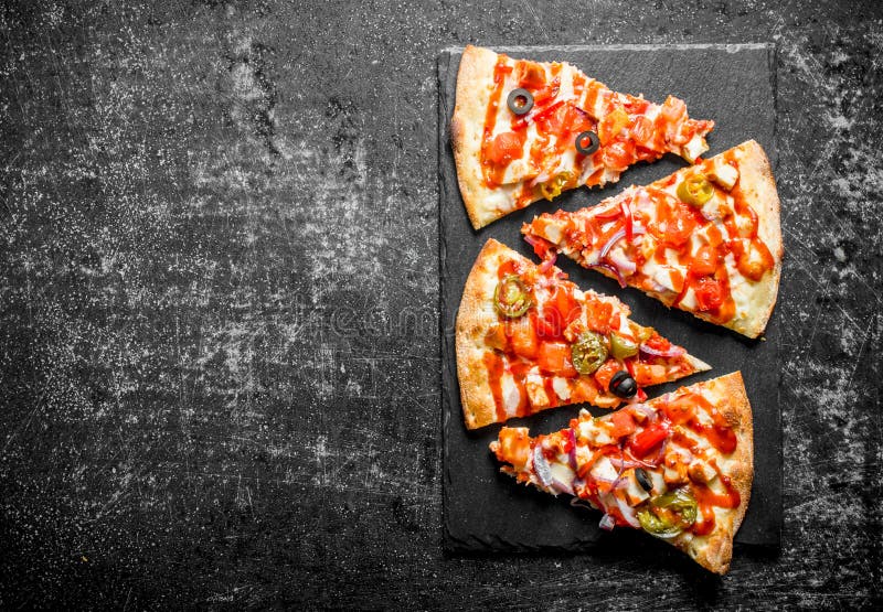 Morceaux de pizza mexicaine photographie stock libre de droits Morceaux de pizza mexicaine photographie stock libre de droits