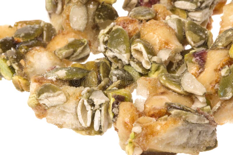 Mordidas da abóbora e do Pistachio isoladas fotografia de stock Mordidas da abóbora e do Pistachio isoladas fotografia de stock