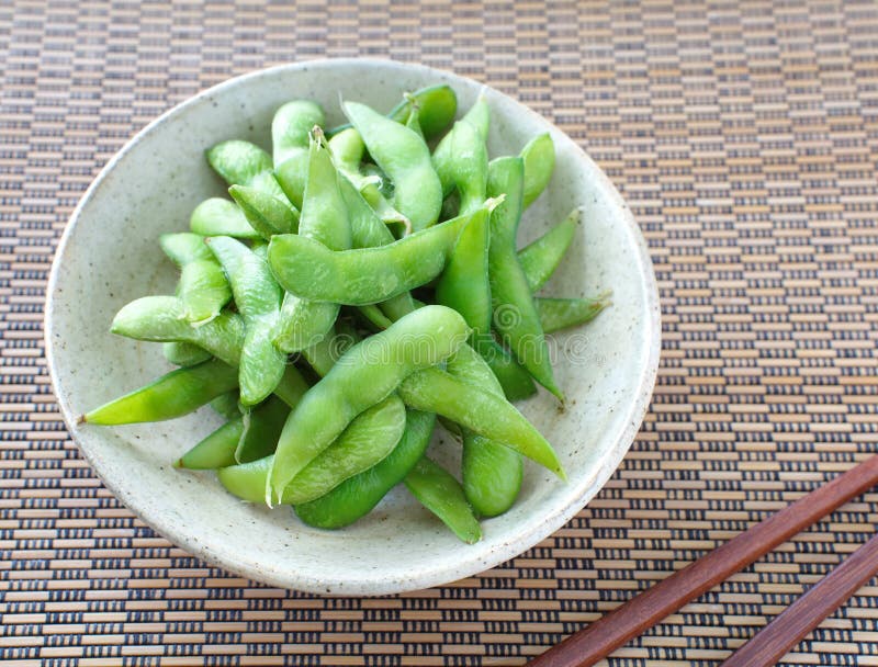 Edamame nibbles, boiled green soy beans, japanese food. Edamame nibbles, boiled green soy beans, japanese food