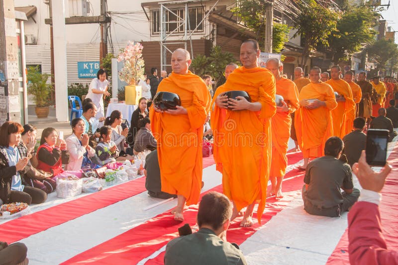 More monks with give alms bowl which came out of the offerings in the morning at Buddhist temple, Culture Heritage Site. More monks with hand holding give alms stock photography More monks with give alms bowl which came out of the offerings in the morning at Buddhist temple, Culture Heritage Site. More monks with hand holding give alms stock photography